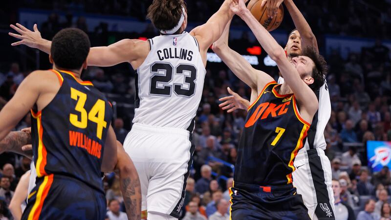 San Antonio Spurs center Victor Wembanyama, back right, blocks a shot by Oklahoma City Thunder...