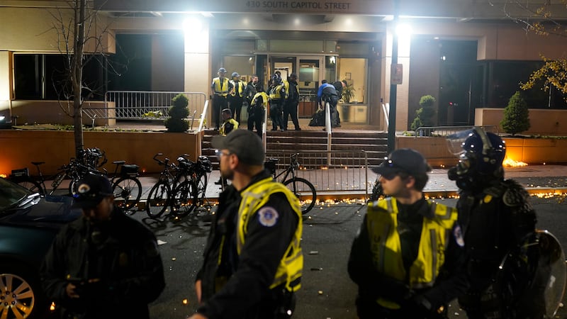 U.S. Capitol Police stand outside the headquarters of the Democratic National Committee...