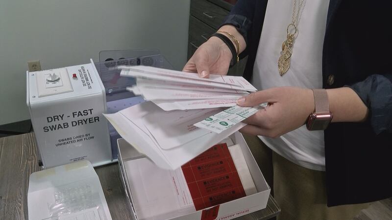 Heather Dollar shows the contents of a sexual assault evidence kit