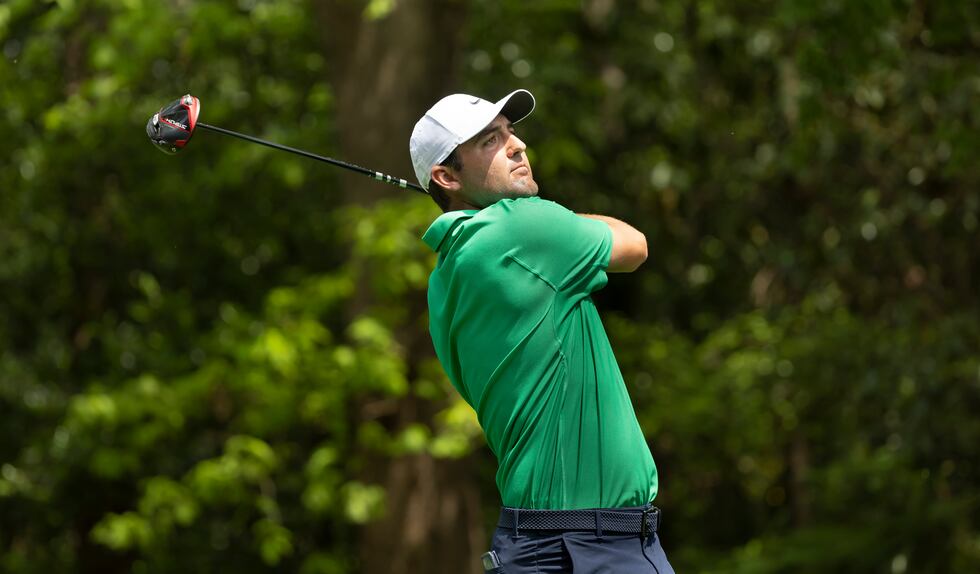 Masters champion Scottie Scheffler of the United States plays a stroke from the No. 2 tee...
