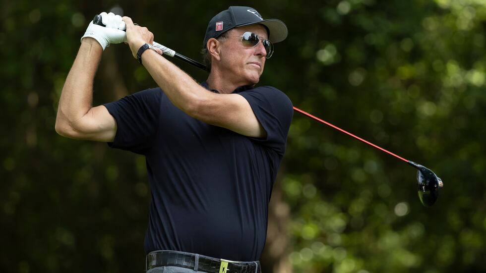 Masters champion Phil Mickelson of the United States plays a stroke from the No. 2 tee during...
