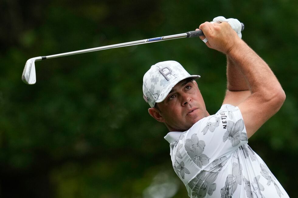 Gary Woodland watches his tee shot on the fourth hole during the second round of the Masters...
