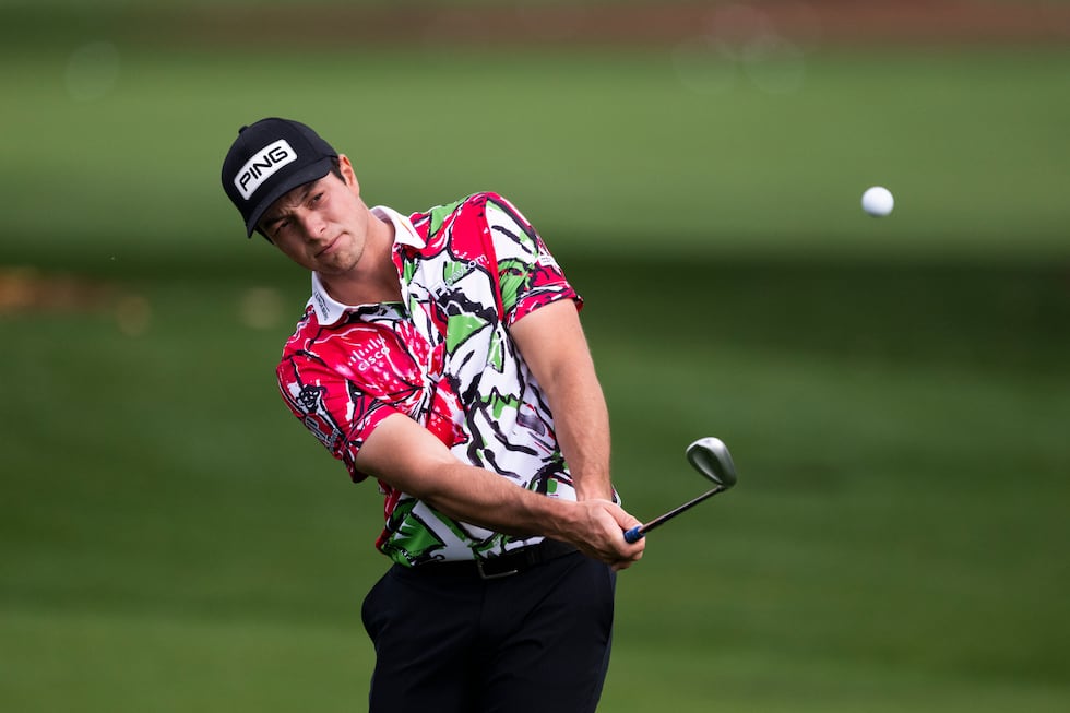 Viktor Hovland of Norway warms up on the Tournament Practice Area during the first round of...