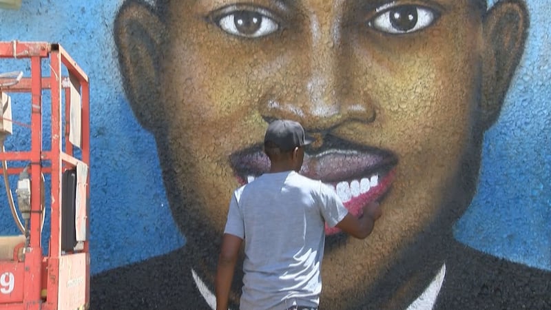 Painting of the Ahmaud Arbery mural.