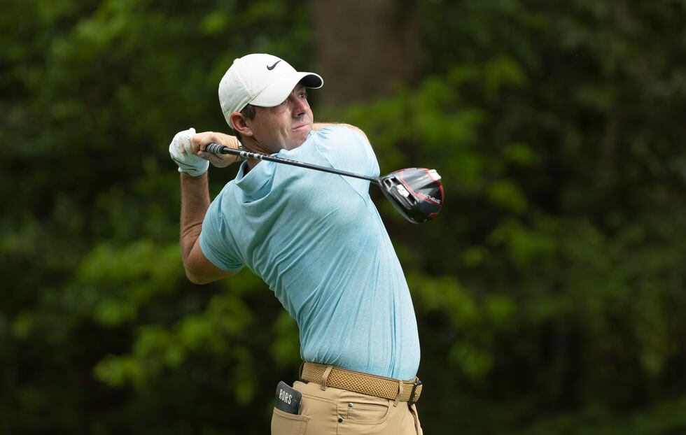 Rory McIlroy of Northern Ireland plays a stroke from the No. 2 tee during the first round of...