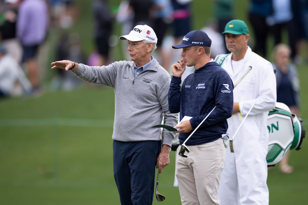 Masters champion Larry Mize of the United States and Amateur Ben Carr of the United States...
