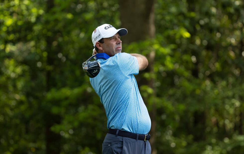 Masters champion Charl Schwartzel of South Africa plays a stroke from the No. 2 tee during the...