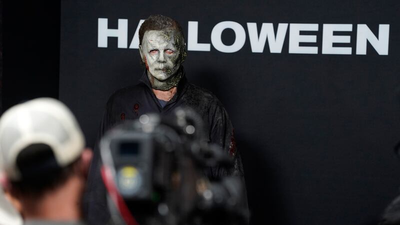 A man dressed as the killer character Michael Myers (aka The Shape) from the "Halloween" films...