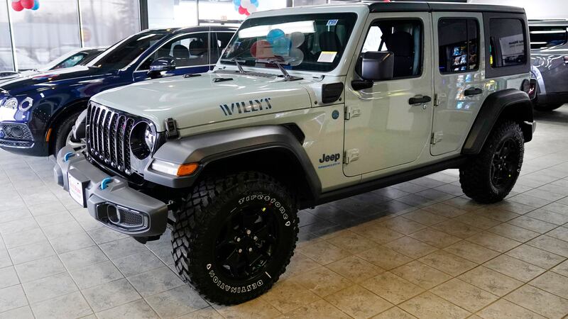 An electric Jeep Wrangler is displayed on the showroom floor at the Dan O'Brien Auto Group...